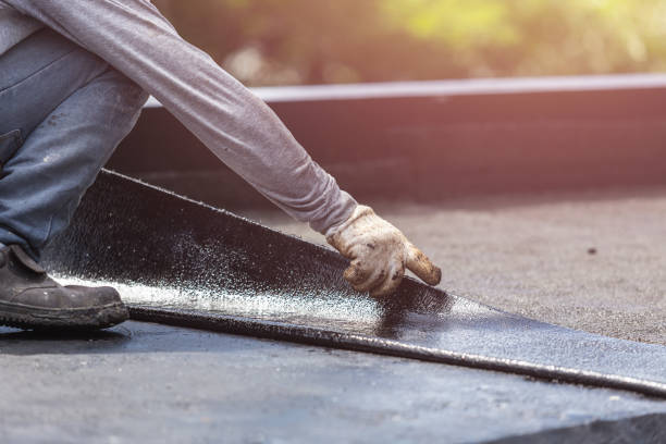 Professional Basement Waterproofing technician working in Fenwick, MI